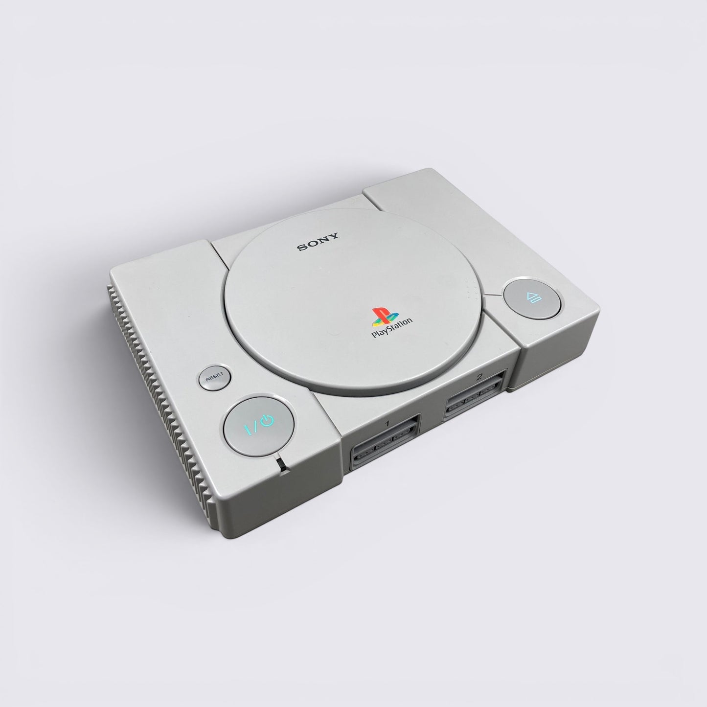 MrPixel grey Sony PlayStation 1 console featuring iconic disc drive lid and front controller ports