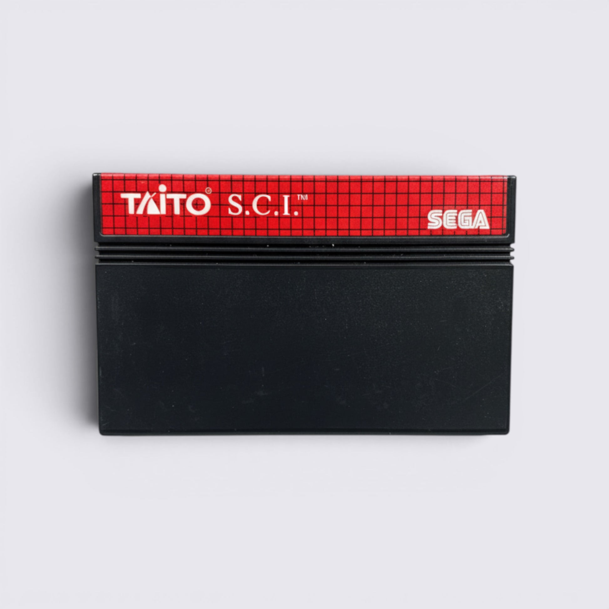 MrPixel Special Criminal Investigation Sega arcade game cartridge with red grid label on a grey stone background