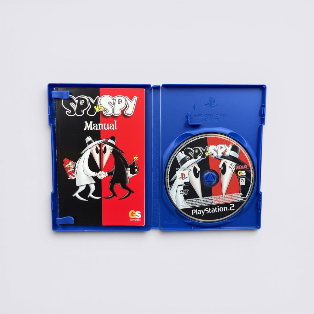 MrPixel Spy vs Spy PlayStation 2 game case open with manual and game disc featuring iconic black and white spies