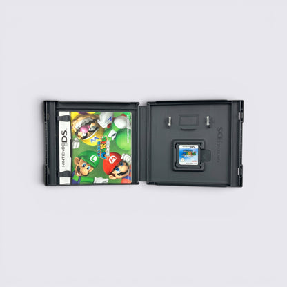 MrPixel Super Mario 64 DS game case open with instruction booklet and game cartridge on a grey surface