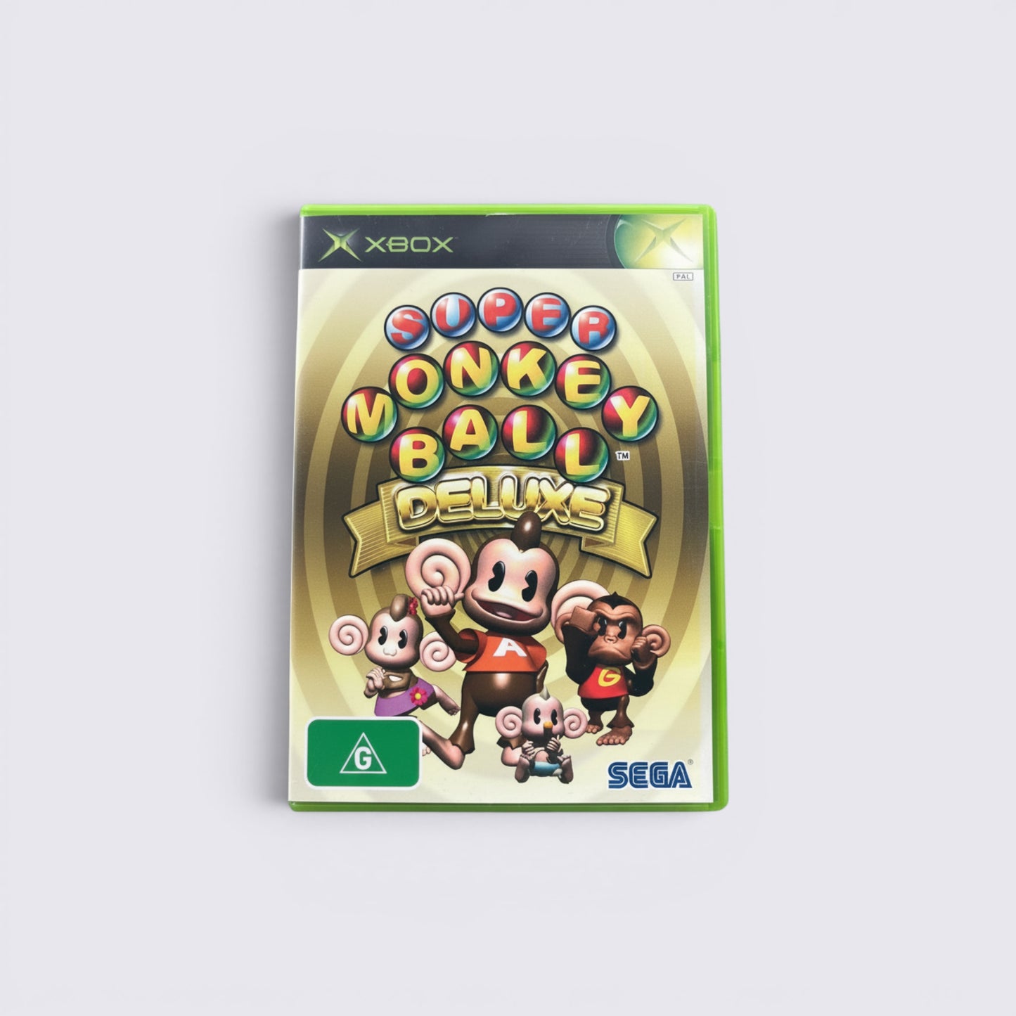 MrPixel Super Monkey Ball Deluxe Xbox game case featuring AiAi and friends on a gold background