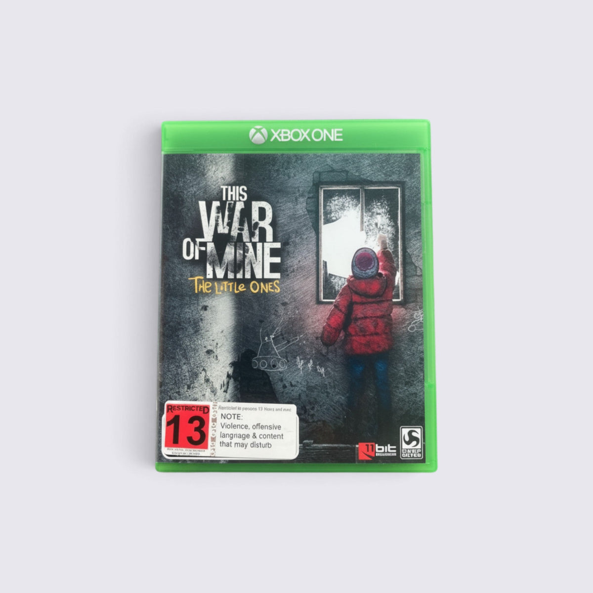 MrPixel This War of Mine The Little Ones video game for Xbox One featuring a child in a red coat by a window