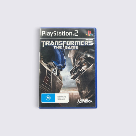 MrPixel Transformers The Game for PlayStation 2 featuring Autobot and Decepticon face-off cover art