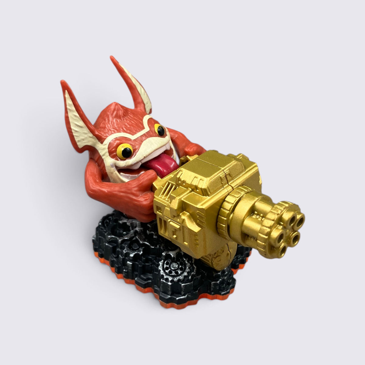 MrPixel Trigger Happy Series 2 Skylander figure with red creature holding a large golden rapid-fire gun on black base