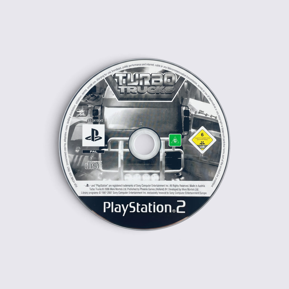 MrPixel Turbo Trucks game disc for PlayStation 2 featuring a monochrome truck graphic and official branding