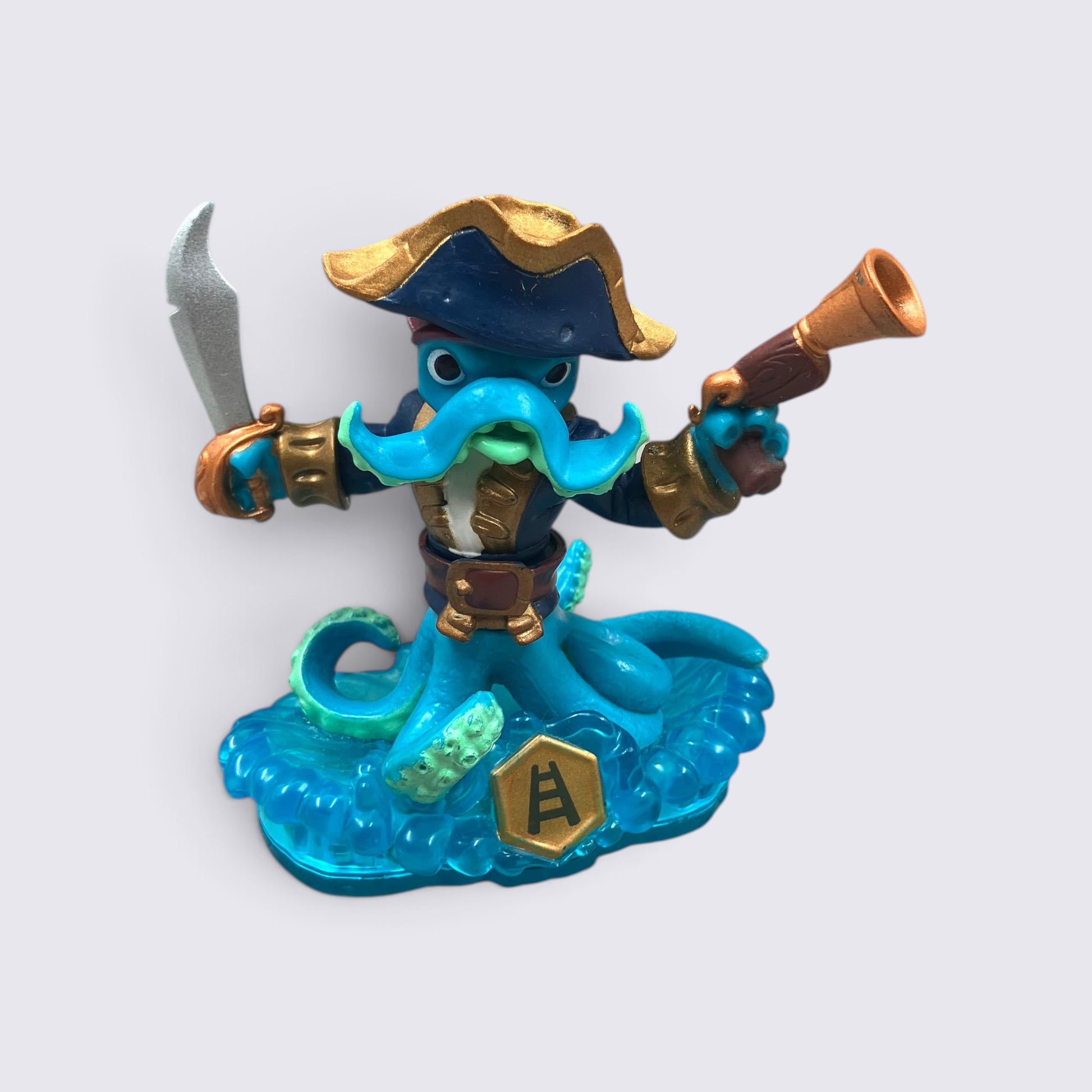 MrPixel Wash Buckler Skylander figure with blue octopus tentacles, pirate hat, cutlass, and water blaster weapon.