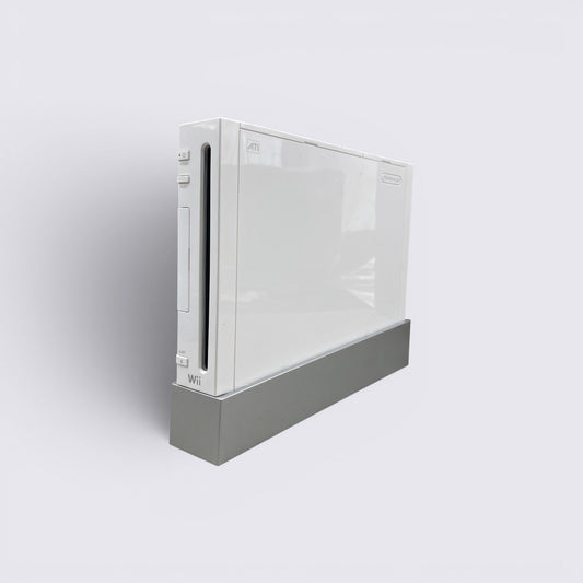 MrPixel white Nintendo Wii home gaming console standing vertically on a grey base against a neutral background
