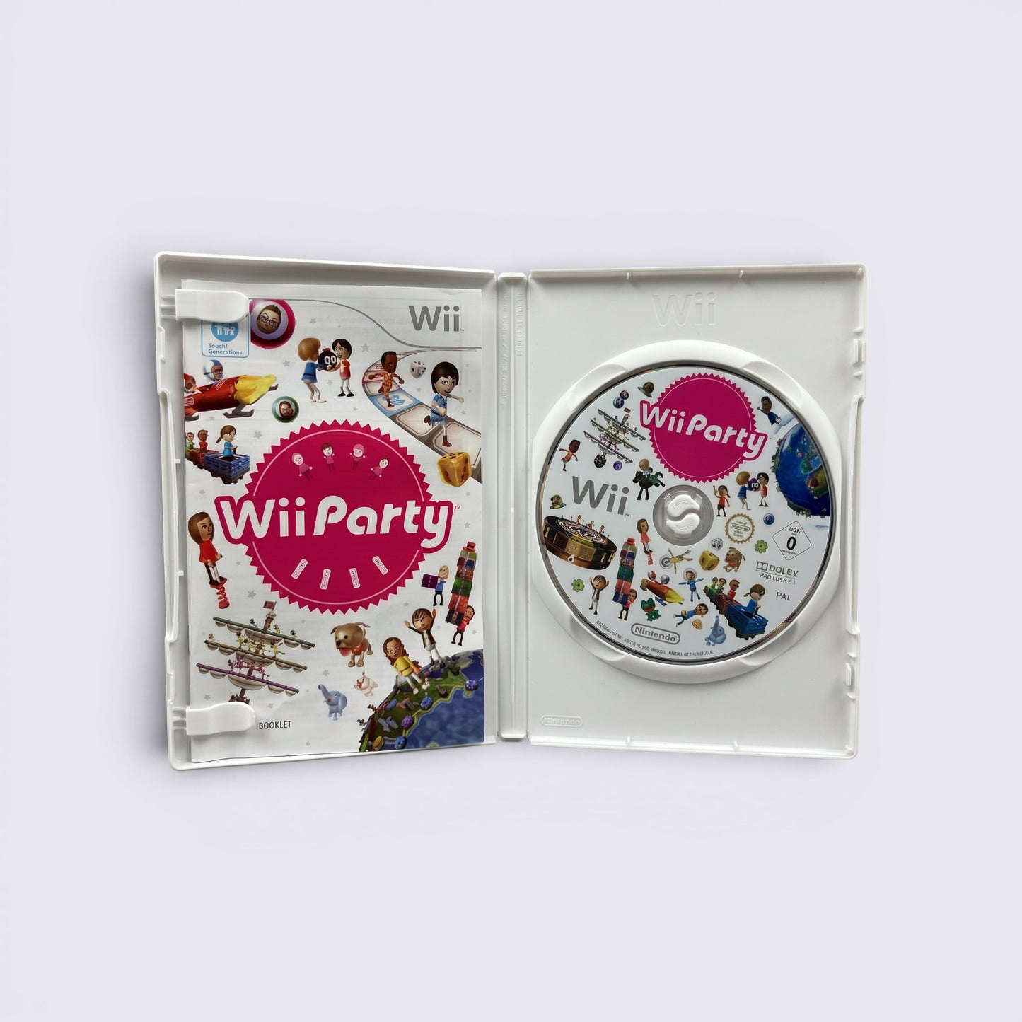 MrPixel Wii Party game case open showing the disc and instruction booklet with colorful Mii character graphics