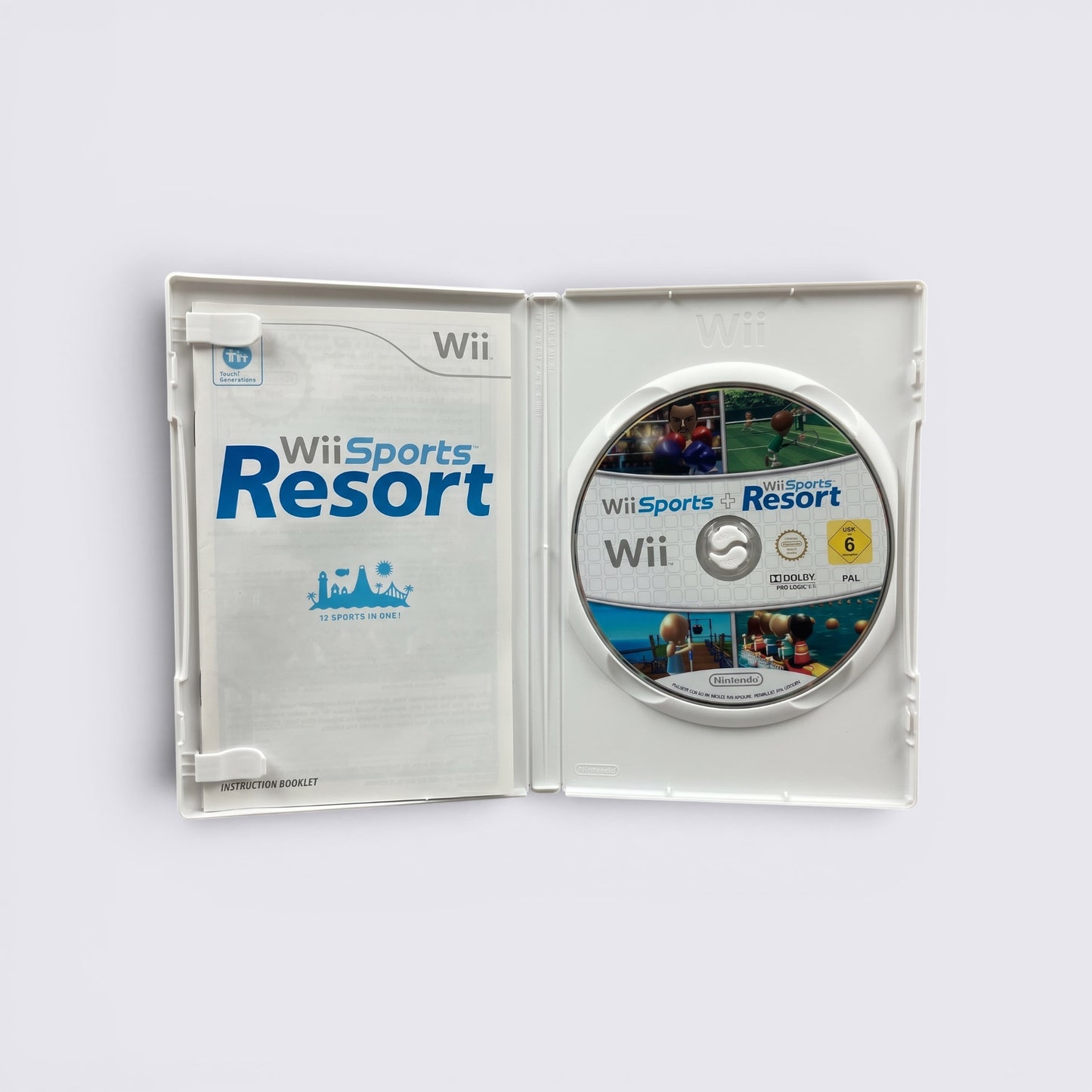MrPixel Wii Sports and Wii Sports Resort game disc and instruction manual inside an open white Nintendo Wii case.
