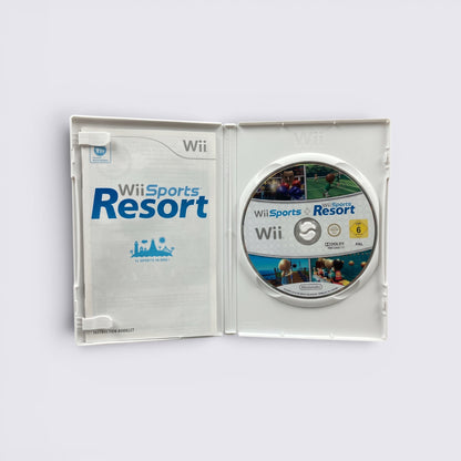 MrPixel Wii Sports and Wii Sports Resort game disc and instruction manual inside an open white Nintendo Wii case.