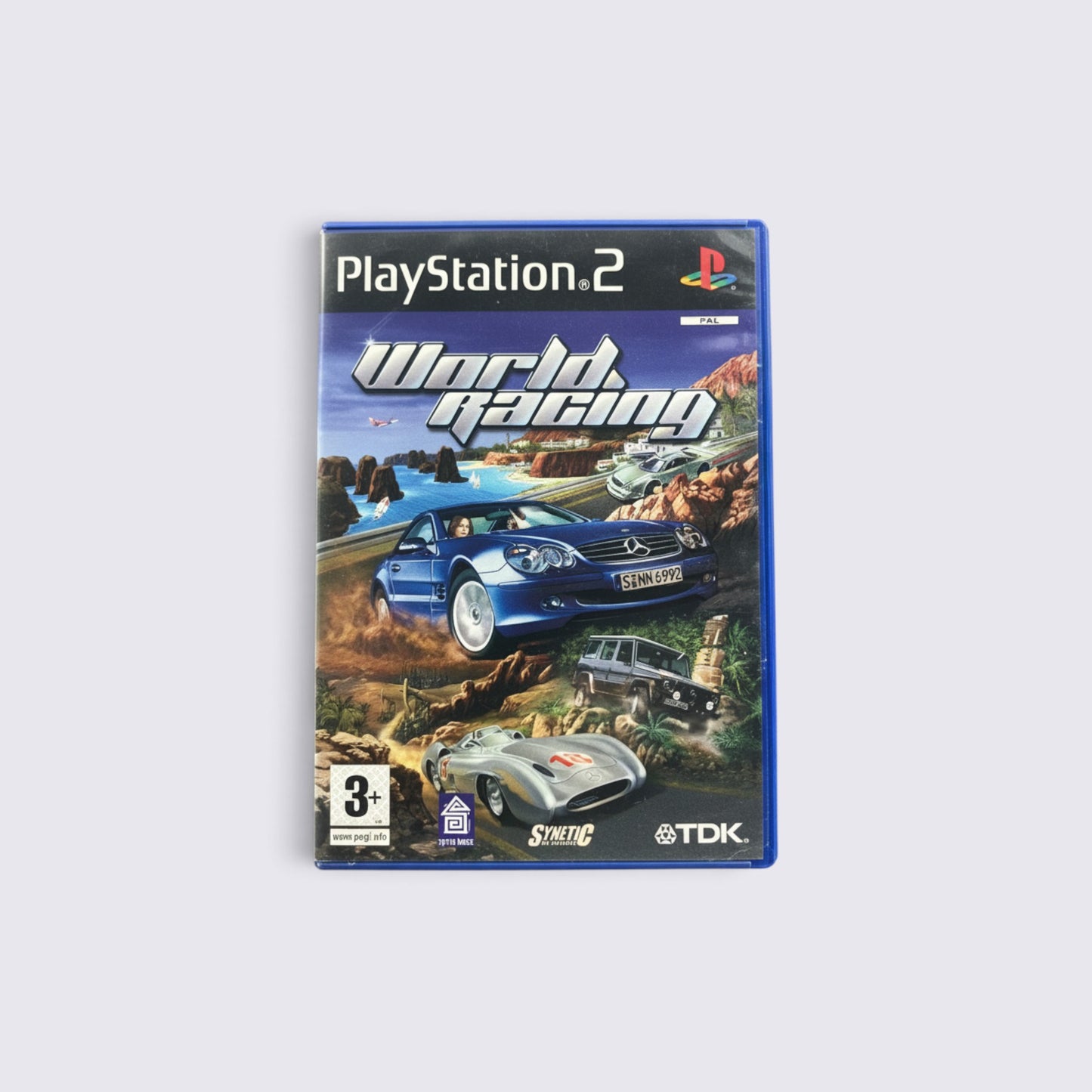 MrPixel World Racing PlayStation 2 game case featuring a blue Mercedes sports car on a scenic coastal race track