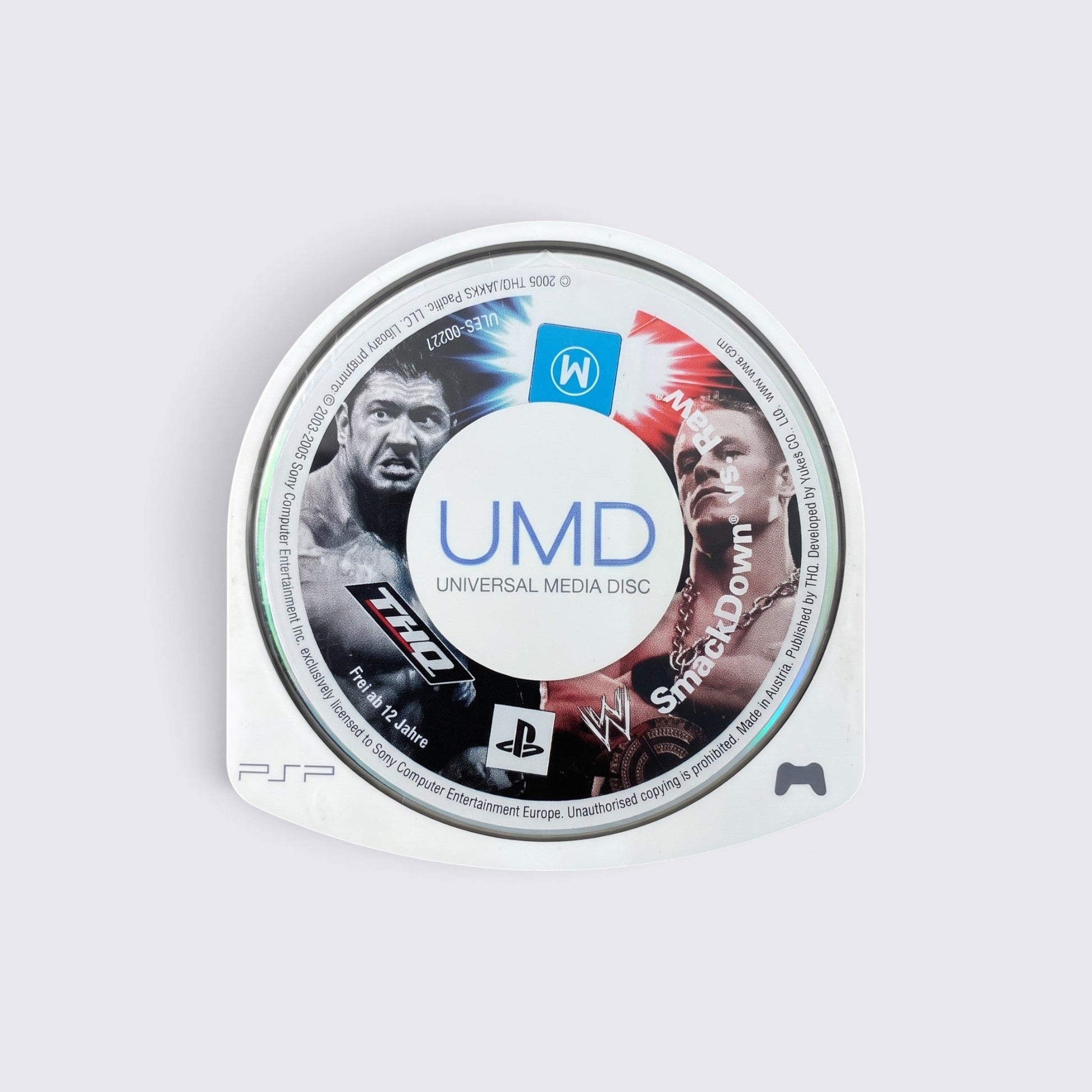 MrPixel WWE SmackDown! vs. Raw 2006 UMD disc for Sony PSP featuring Batista and John Cena on the game label.