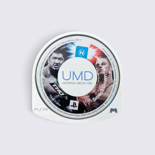 MrPixel WWE SmackDown! vs. Raw 2006 UMD disc for Sony PSP featuring Batista and John Cena on the game label.