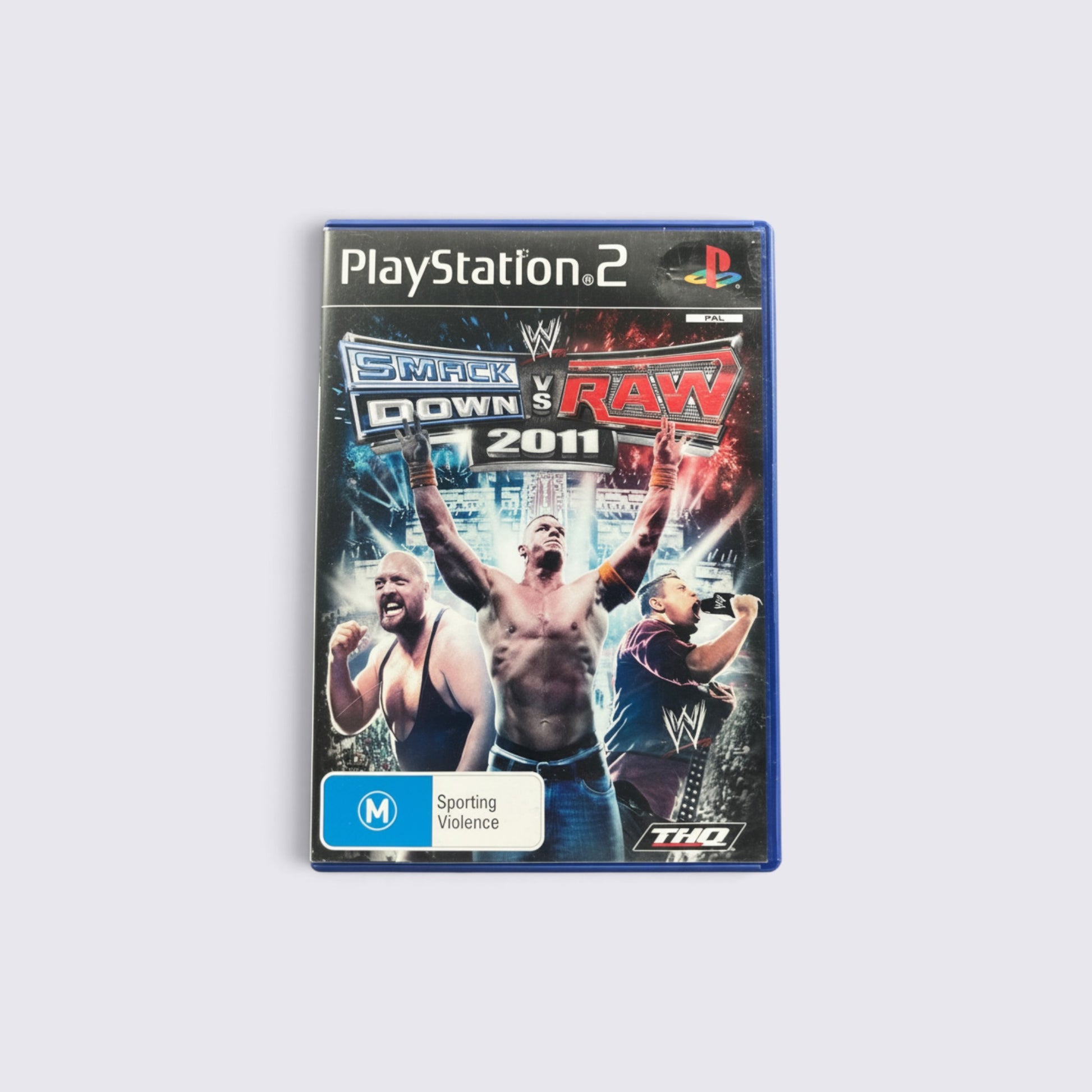 MrPixel WWE SmackDown vs. Raw 2011 PlayStation 2 game case featuring John Cena, Big Show, and Rey Mysterio.