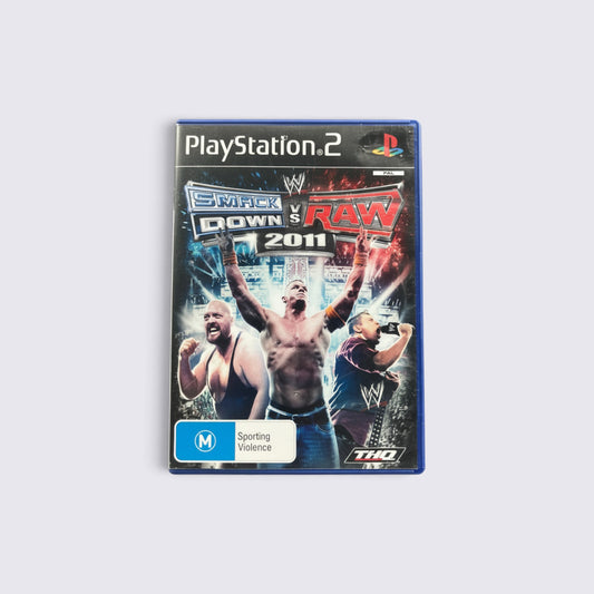 MrPixel WWE SmackDown vs. Raw 2011 PlayStation 2 game case featuring John Cena, Big Show, and Rey Mysterio.