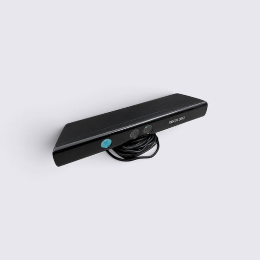 MrPixel black Xbox 360 Kinect motion-sensing camera sensor with integrated cable on a plain white background