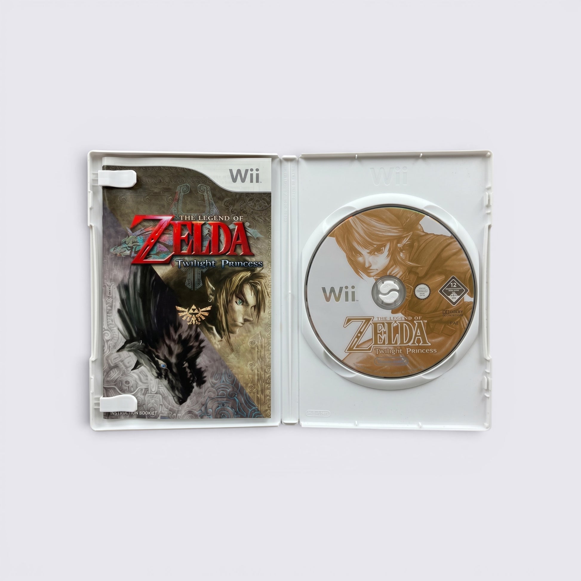 MrPixel The Legend of Zelda: Twilight Princess Wii game case open with disc and instruction booklet inside.