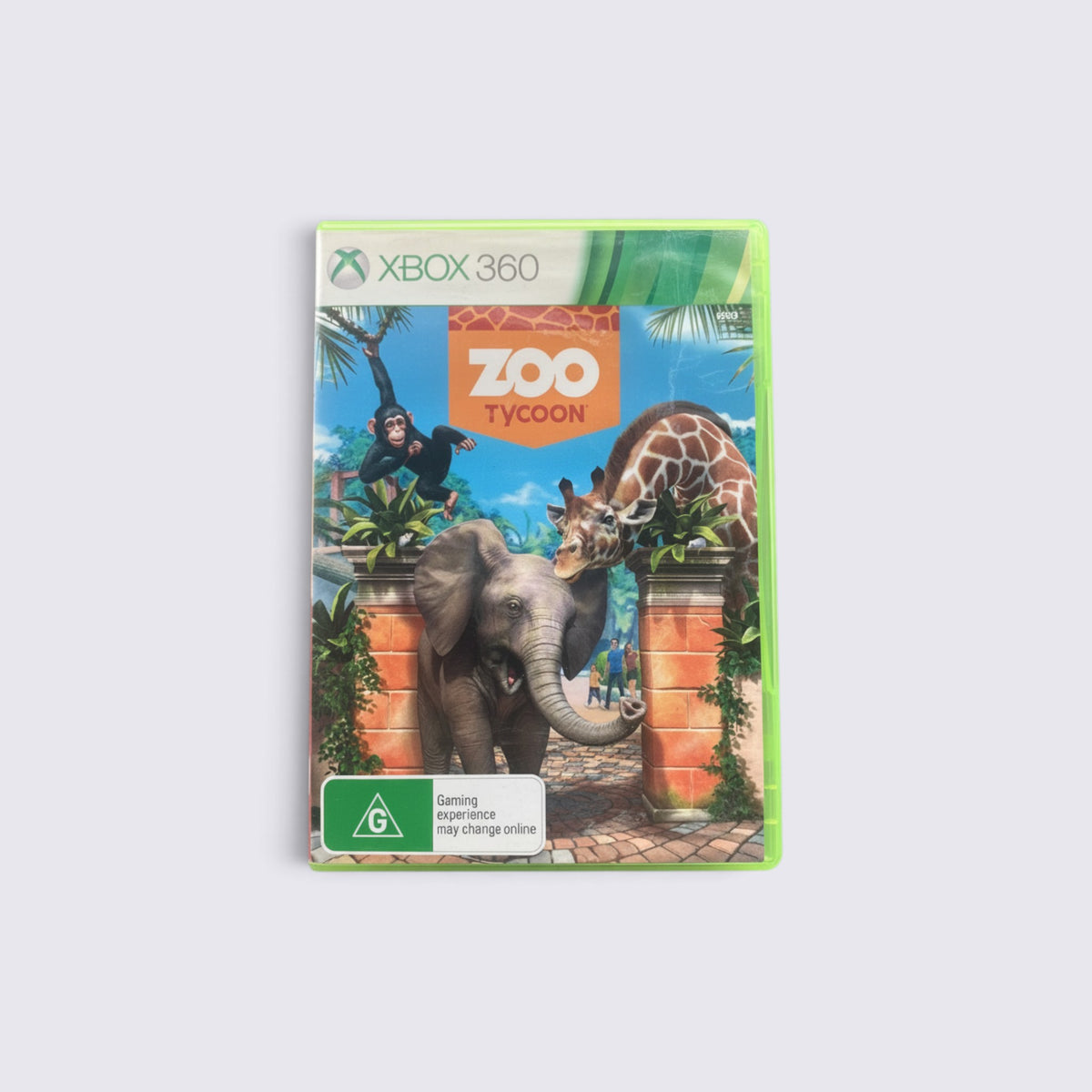 MrPixel Zoo Tycoon video game for Xbox 360 featuring a chimpanzee, elephant, and giraffe on the cover art