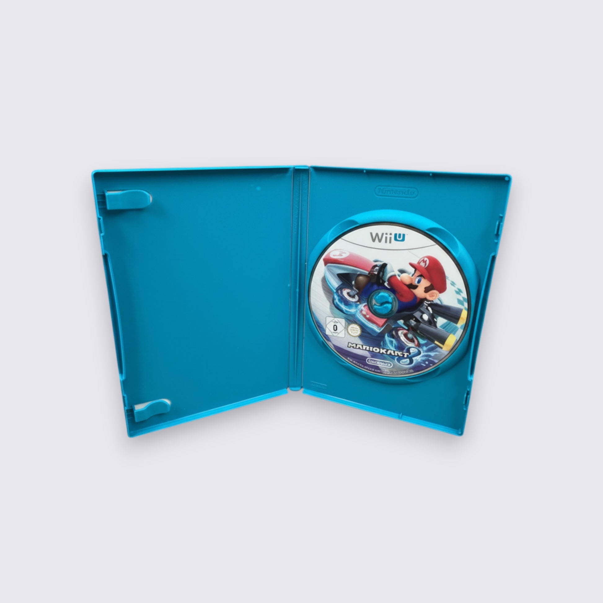 MrPixel Mario Kart 8 Wii U game disc inside an open bright blue plastic case featuring Mario in his racing kart.